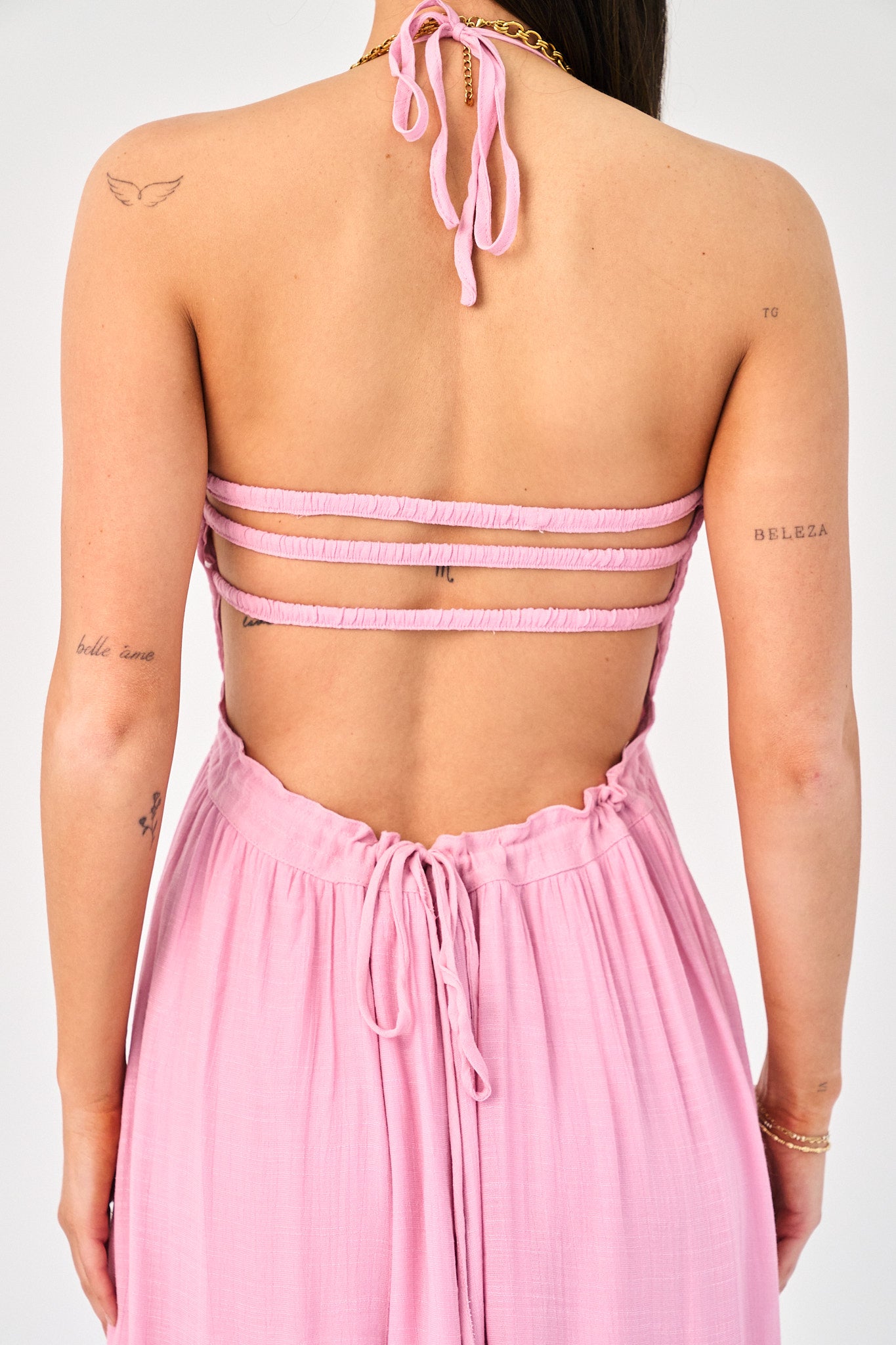 open back of a pink maxi dress