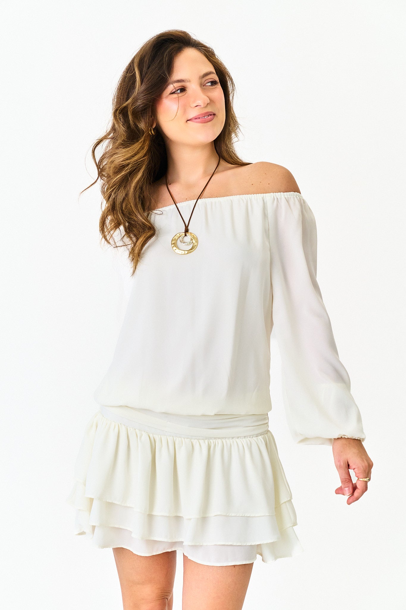 Woman wearing a white off-shoulder dress on a white background