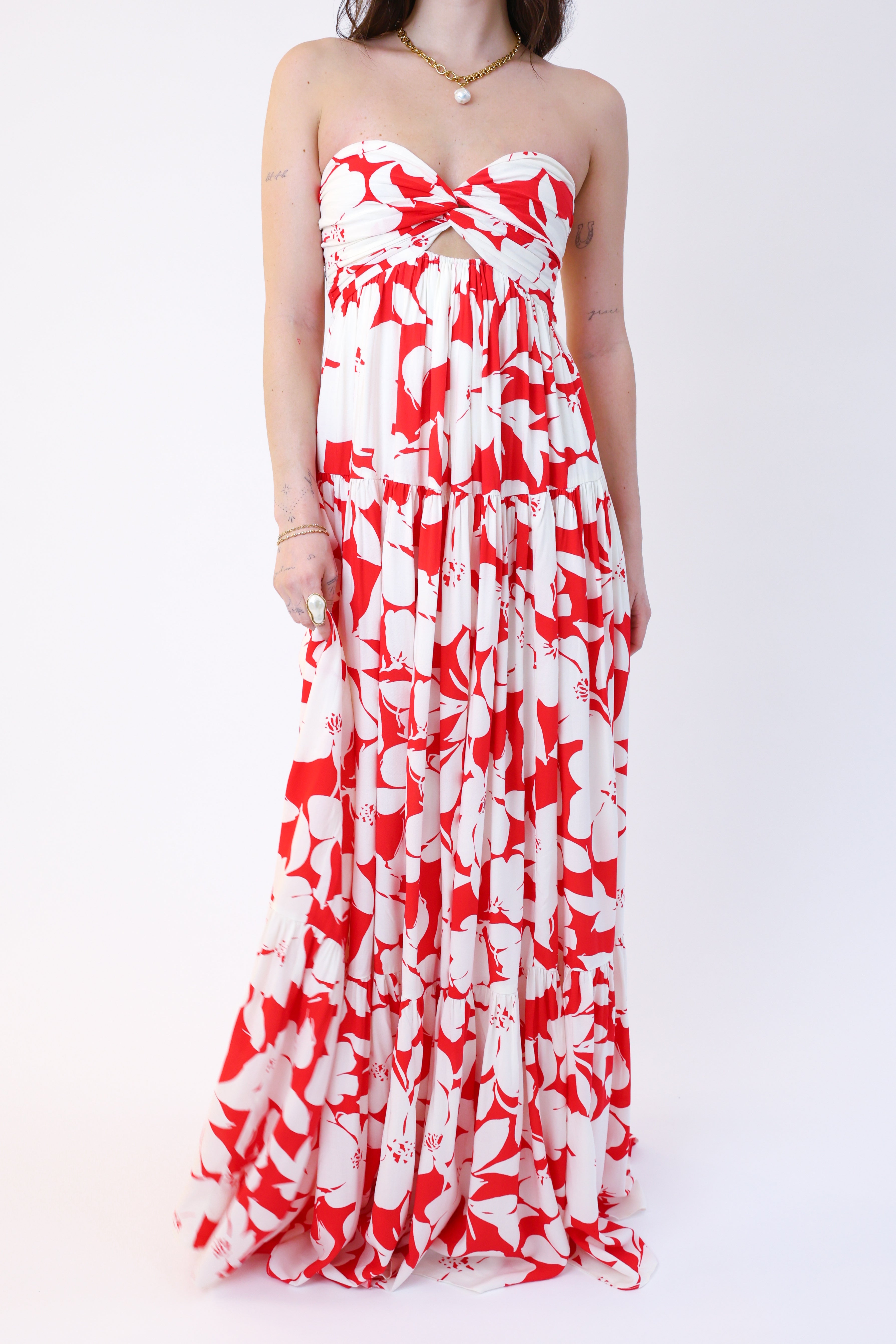 Red and white floral strapless dress on a white background