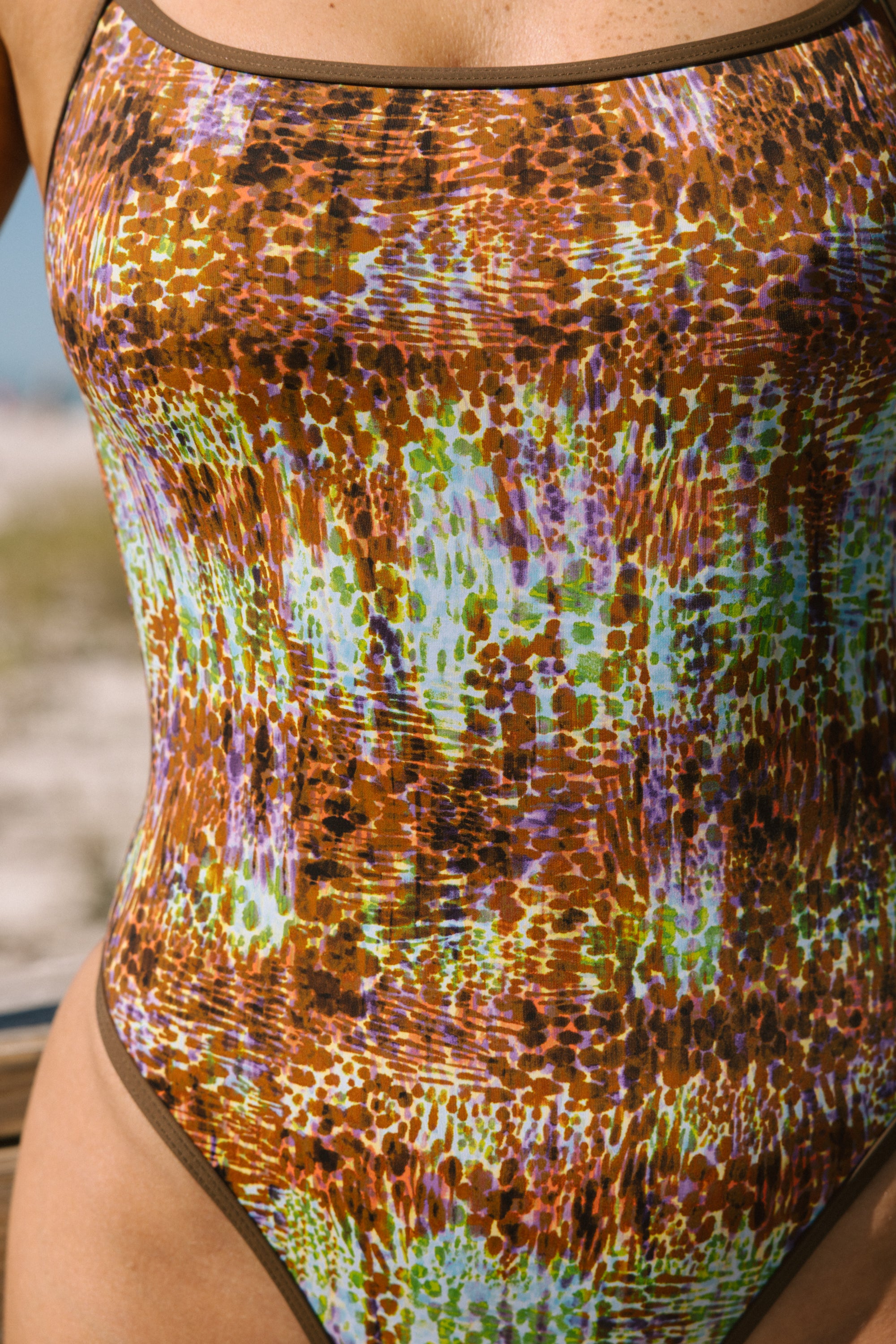 Multicolored swimsuit with a patterned design.