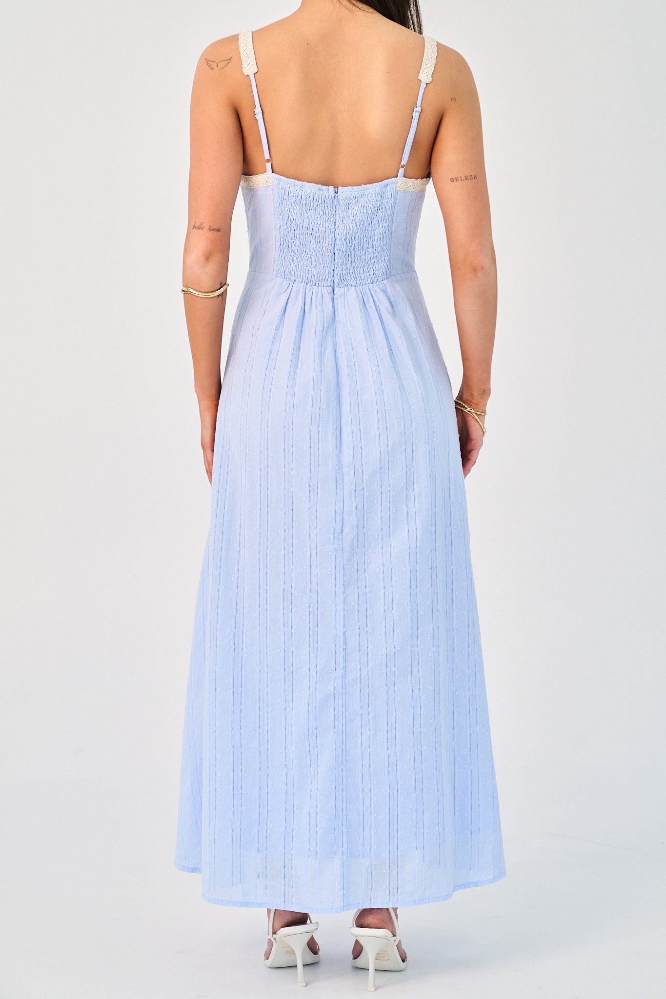 Light blue dress with thin straps on a white background