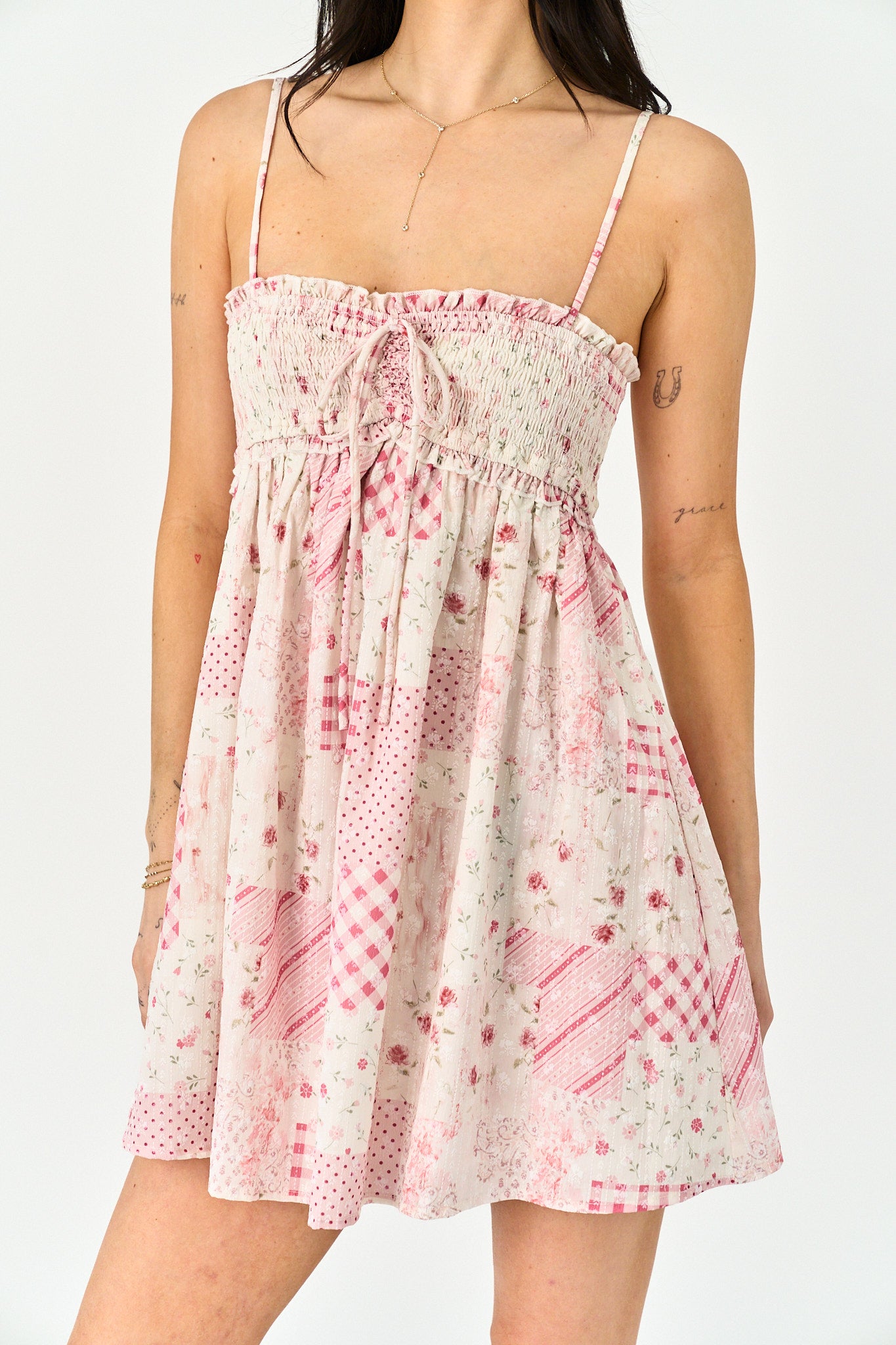 Woman wearing a floral dress on a white background
