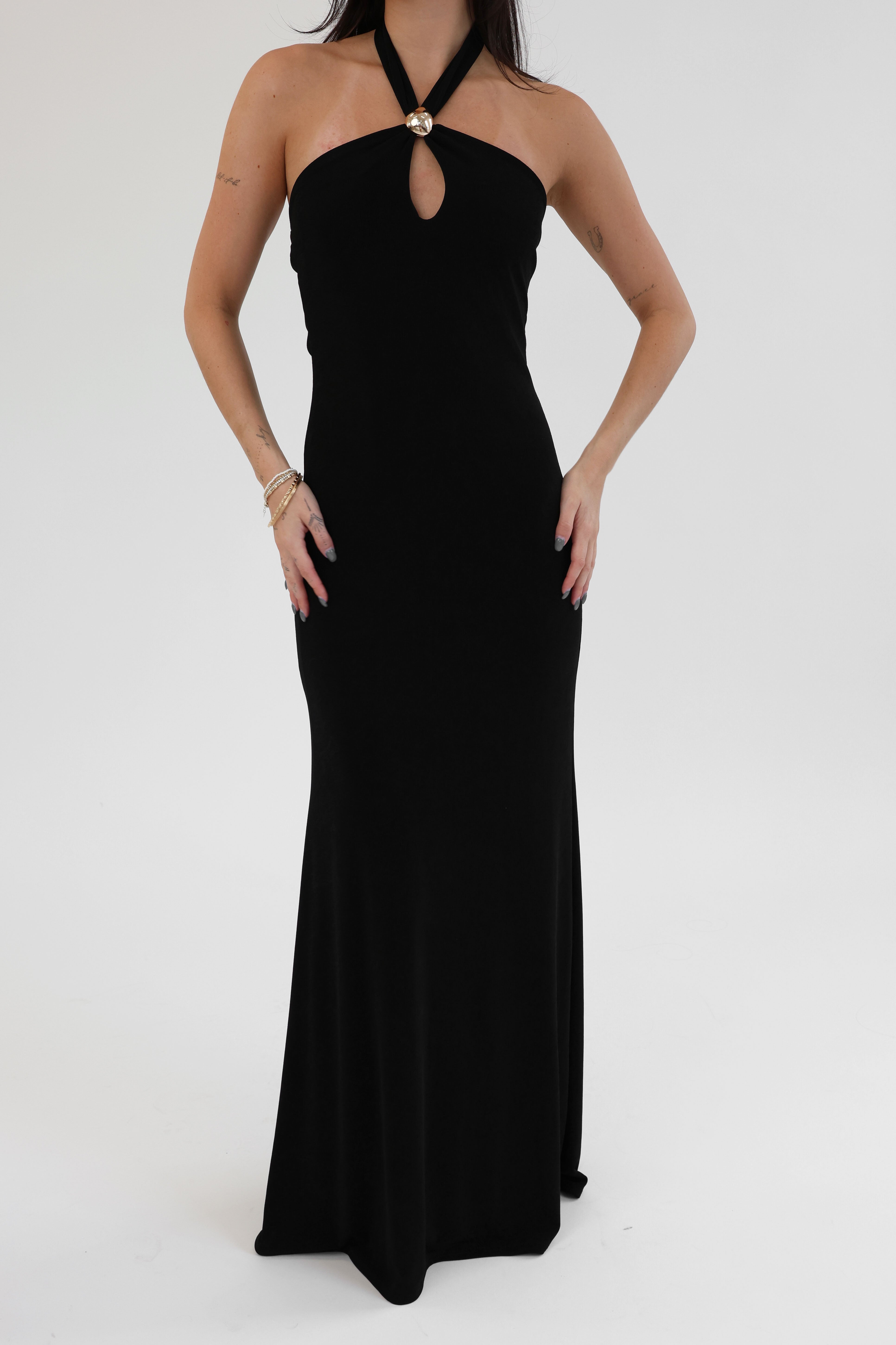 Black halter neck gown on a white background