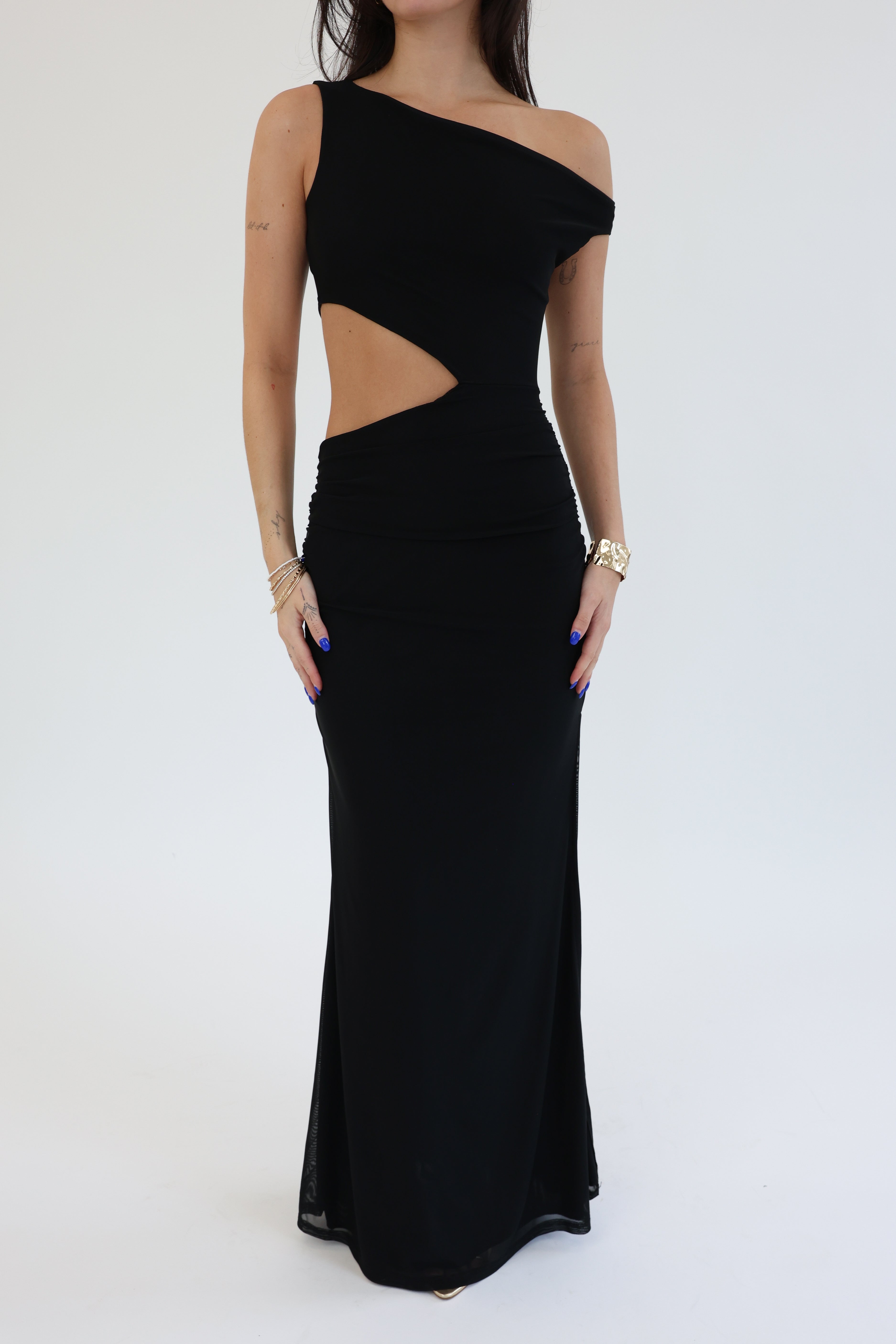 Black one-shoulder evening gown with cutout design on a white background
